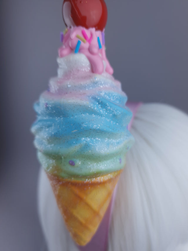 Close up of glittered ice cream headdress with a cherry on top