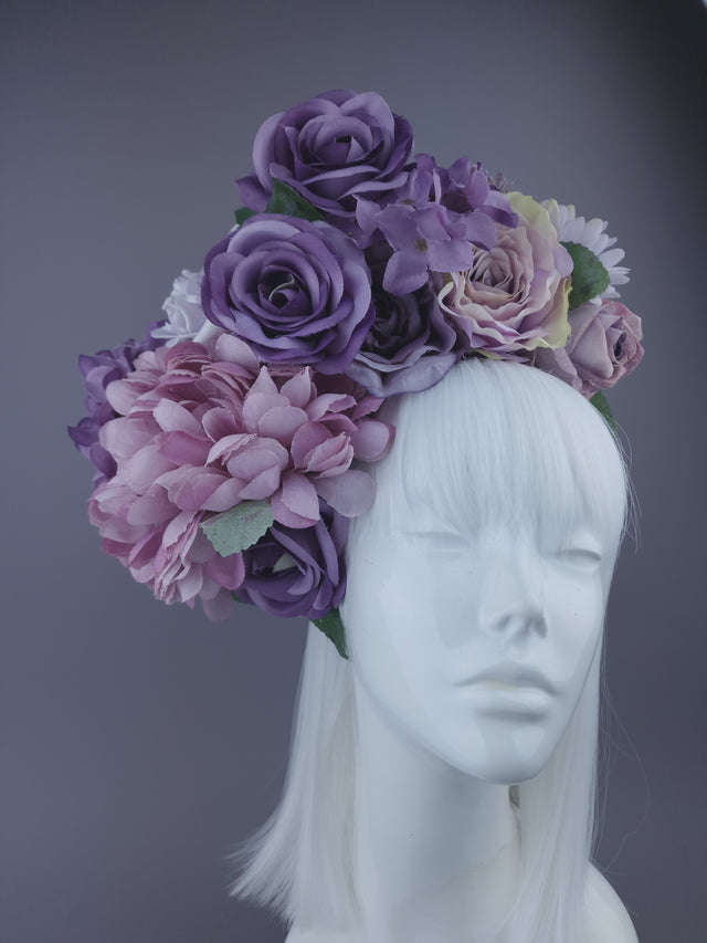Oversized purple and mauve flower headdress close up