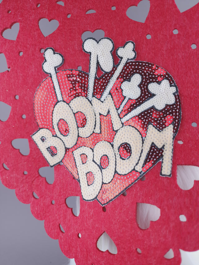 Large red heart headpiece with fun sequin heart on the inside with 'Boom Boom' lettering.