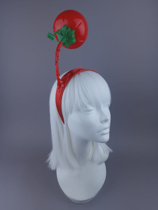 retro tomato sauce pouring on a red Alice band.