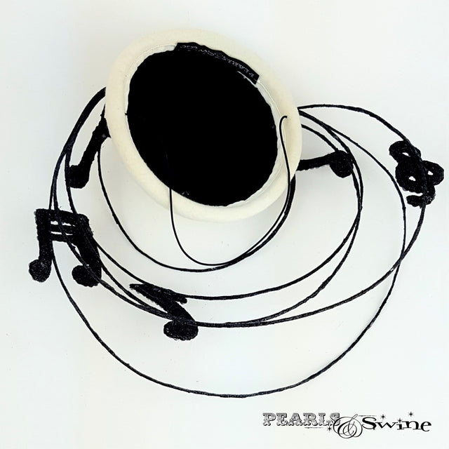 Satin lined musical notes hat