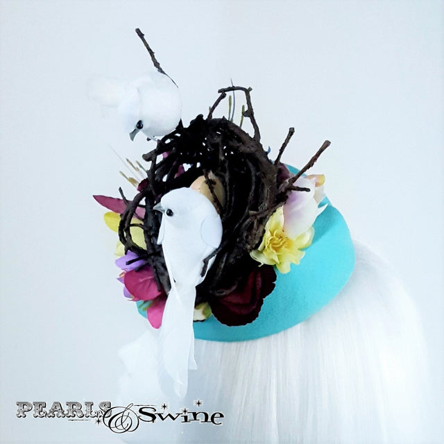 White Birds in a nest hat