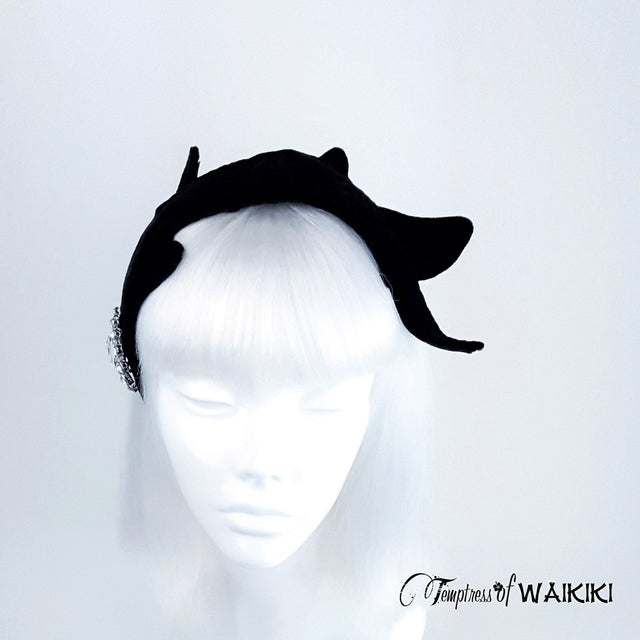 Quirky black guitar headpiece