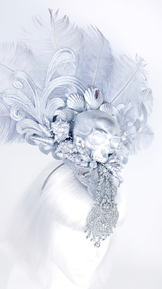 P&SSALE09:feathered skull w/shells and jewels