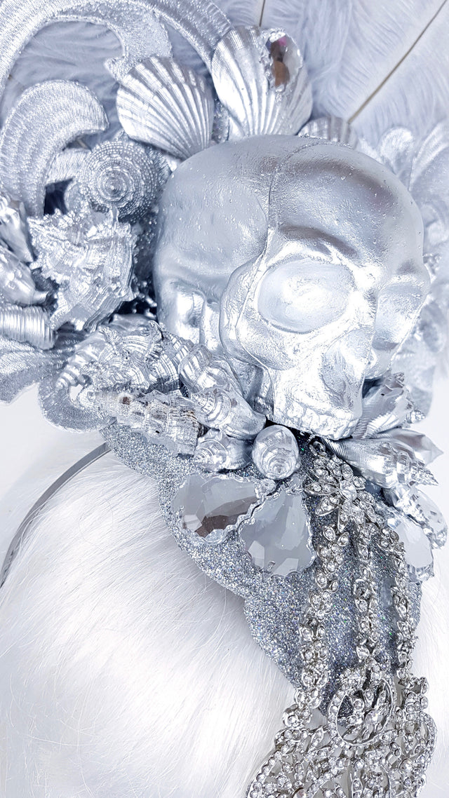 P&SSALE09:feathered skull w/shells and jewels