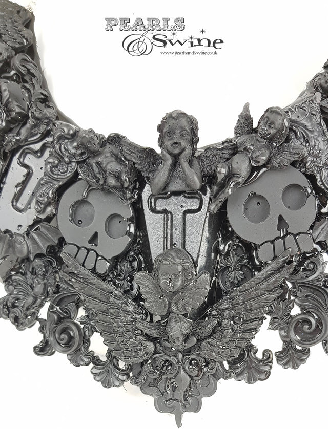 skull and coffins necklace