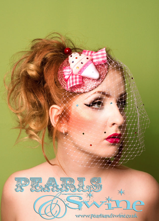 Limited edition ice cream fascinator set pink hand glittered fascinator base, decorated with a little ice cream and a pink birdcage veil sprinkled with candy coloured crystals. The ice cream fascinator is backed with leopard print satin and attaches with a comb and adjustable hat elastic.