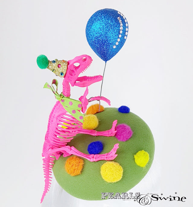 A Dinosaur with a balloon hat