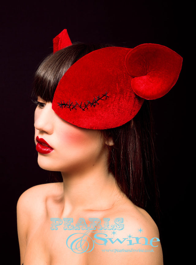 Ray Caesar Inspired Half Mask Fascinator "L'accord D'Amour" Red velvet, half mask fascinator red velvet ears and a stitched up eye so you can see out of the eye. This mask is blocked by hand in millinery felt, hand stitched then backed with satin. If you wear an eyepatch this is a lovely alternative if you wish to make a fashion statement. This can be made in other colours and if you prefer i can cut the eye so it's completely open as i do with all the rest of my half mask fascinators.