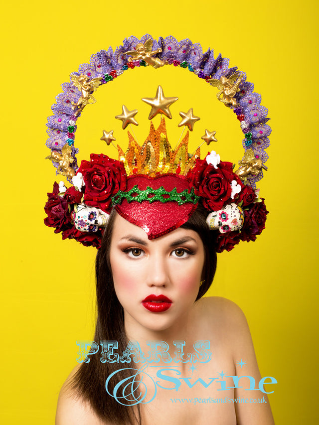 Virgin Mary Headdress Crown "Our Lady of Guadalupe" One-of-a-kind Mary headdress, inspired by the shrine in Mexico City, featuring a hand-moulded red glittered sacred heart decorated with sequins and crystals, red velvet roses, cherubs, a purple lace halo sprinkled in gems, stars, and hand decorated sugar skulls and set on a headband.