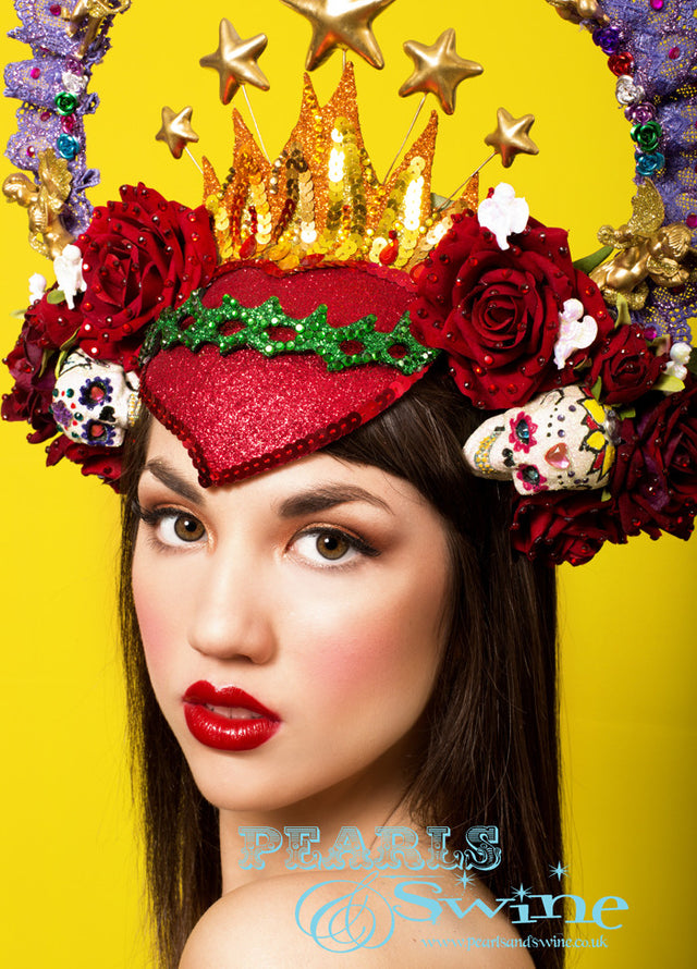Virgin Mary Headdress Crown "Our Lady of Guadalupe" One-of-a-kind Mary headdress, inspired by the shrine in Mexico City, featuring a hand-moulded red glittered sacred heart decorated with sequins and crystals, red velvet roses, cherubs, a purple lace halo sprinkled in gems, stars, and hand decorated sugar skulls and set on a headband.