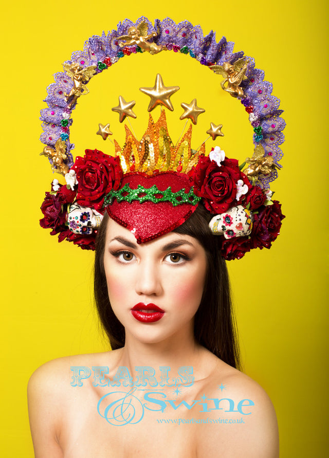 Virgin Mary Headdress Crown "Our Lady of Guadalupe" One-of-a-kind Mary headdress, inspired by the shrine in Mexico City, featuring a hand-moulded red glittered sacred heart decorated with sequins and crystals, red velvet roses, cherubs, a purple lace halo sprinkled in gems, stars, and hand decorated sugar skulls and set on a headband.