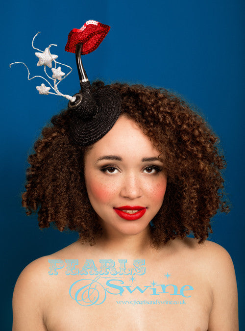 Surreal Pipe Fascinator "Dandy" Dali-esque surreal pipe fascinator featuring red glitter and sequinned lips, smoking a black glittering pipe with silver glittered 'smoke' stars curling out of the pipe. Set on a black fascinator base, backed with leopard print satin, attaches with a comb and hat elastic. This headpiece is quirky and fun but elegant. It's part of a collection of pipe headpiece i have created inspired by "Ceci n'est pas une pipe" by René Magritte, a Belgian surrealist artist aka "This is not