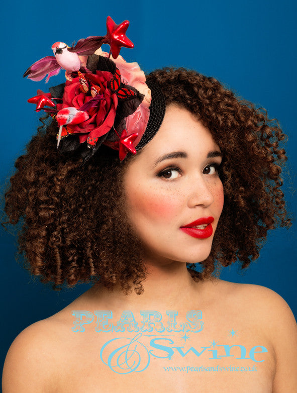 Quirky Heart Fascinator "Transcendence" Limited edition surreal anatomical heart fascinator, bursting with red roses, stars, butterflies and hummingbirds. This quirky heart fascinator is inspired by that joyful feeling, when you are so happy that you could burst! This fascinator attaches with a comb and adjustable hat elastic. I adore anatomical hearts, they are a reoccurring theme and inspiration for me. This headpiece is a piece of wearable art, i recommend you display it in a cabinet when not wearing