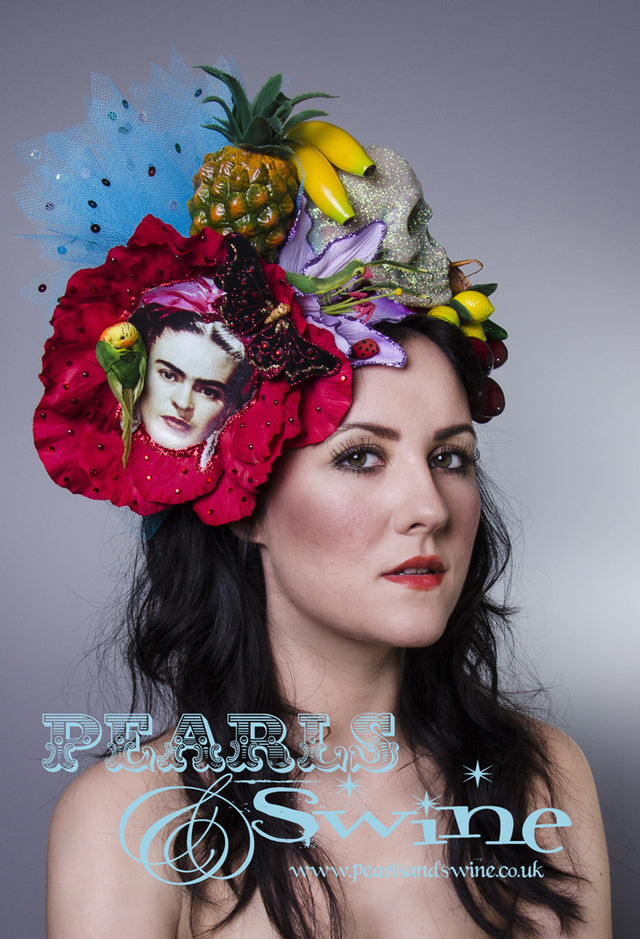 One of a kind Frida Kahlo inspired headdress has a giant red flower, fruit, insects, a glittered skull, a bird, chillies, a printed image of Frida, crystals, net, and sequins, all set on a red glitter headband. Frida is one of my favourite inspirations and icons. She had such incredible style and creativity.