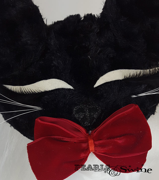 Black fluffy sleeping cat face fascinator