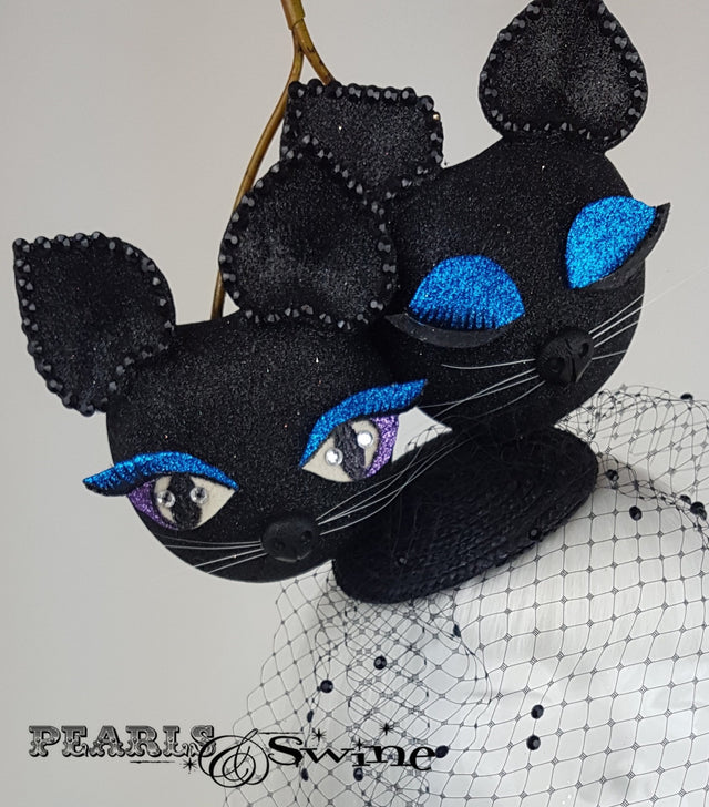 Black glitter giant cherry cats fascinator with a veil