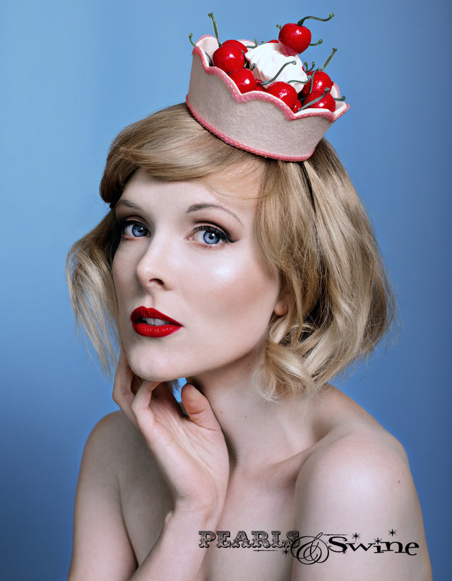 Hand blocked felt bowl fascinator edged with pink pearl sequin filled with lots of artificial cherries and cream