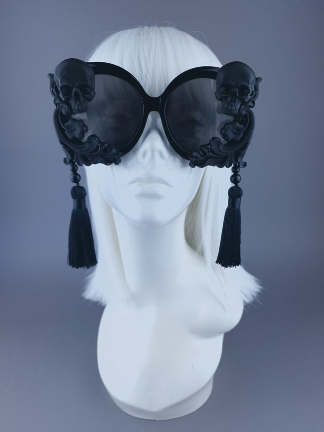 Pearls & Swine: Black Oversized Round Sunglasses with Skull, Filigree, & Tassels "Dade"