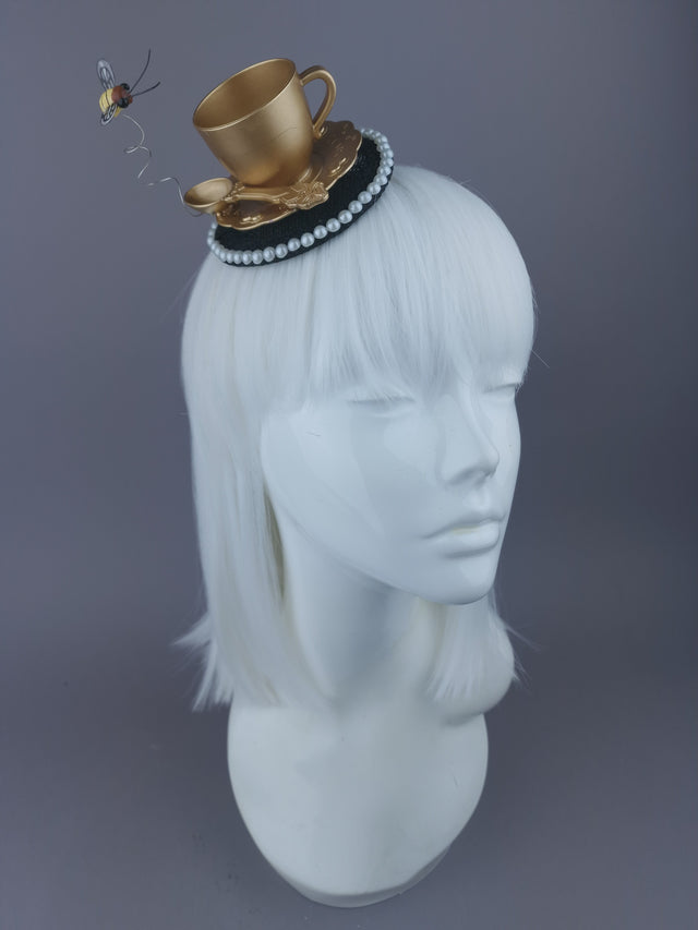 Gold Teacup & Bee Mini Fascinator displayed on a mannequin head