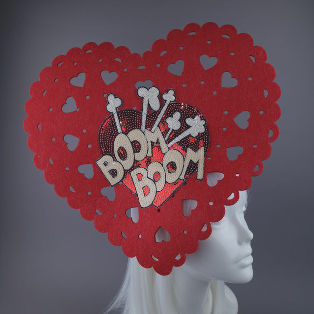 Close up of large red heart headpiece with fun sequin heart on the inside with 'Boom Boom' lettering. 