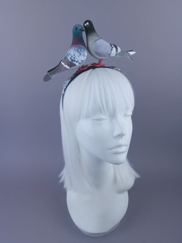 Black headband with two pigeons facing each other with hand-painted poop decorated with crystals, pearls and glitter.