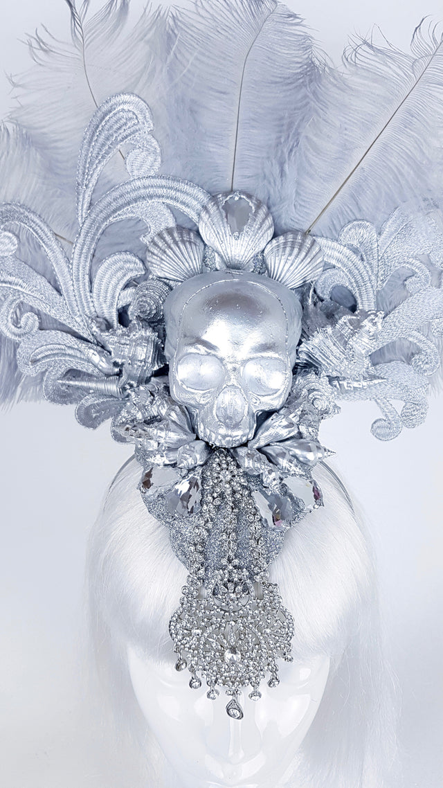 P&SSALE09:feathered skull w/shells and jewels