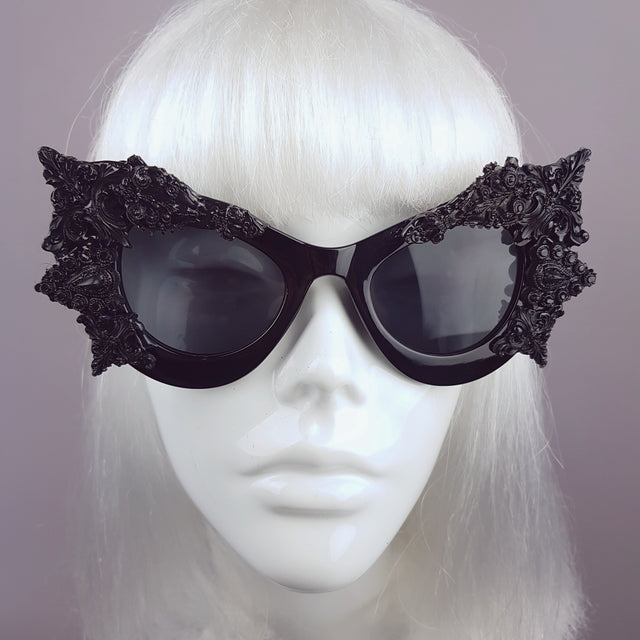 Hand-decorated black filigree ornate sunglasses. 