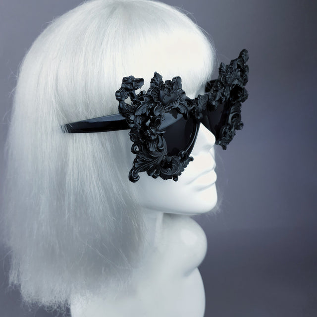 side view oversized hand-decorated black filigree ornate sunglasses.
