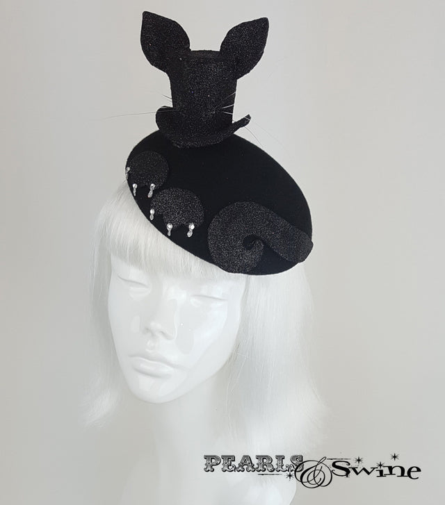 Black glitter mini top hat with cat ears and whiskers set on a blocked felt hat decorated with cat paws and crystal claws.