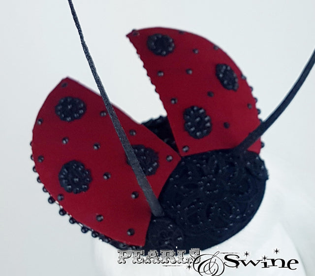 Lace and bead ladybird hat