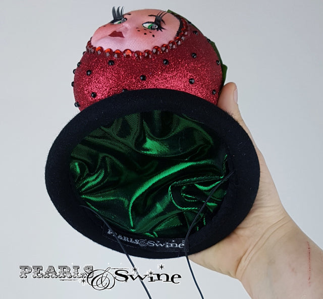 Metalic green lined doll face strawberry hat